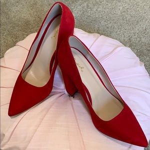 Red suede pumps